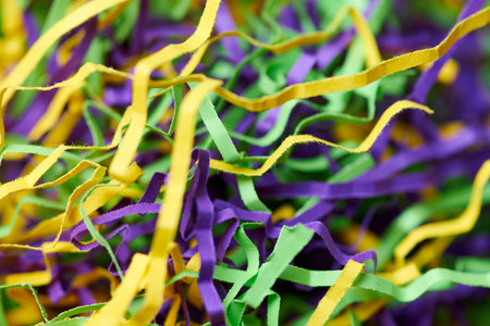 Colorful tinsel, party holiday background. Gift box decorative filler. Beautiful backdrop design for advertising.の写真素材