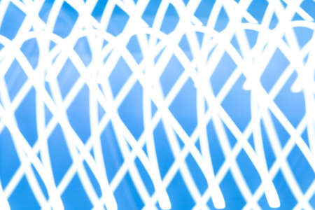 Abstract light background. Blue blured trail lights, strips and bokeh. Beautiful motion painting....