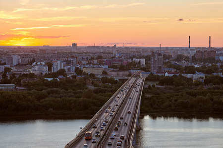 Nizhny Novgorod, Russia - 08.21.2020 - Nizhny Novgorod bridge at sunset. Rapid transit, road bridge, metro metromost over OKA river. Beautiful sunset over cityscape.のeditorial素材