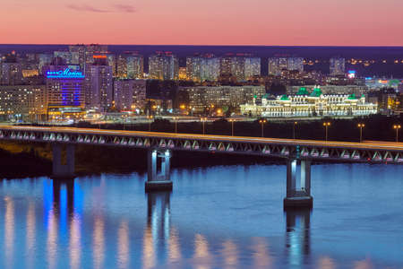 Nizhny Novgorod, Russia - 08.21.2020 - Nizhny Novgorod rapid transit bridge night lights. Metro bridge, metromost over OKA river. Beautiful cityscape in night lightのeditorial素材