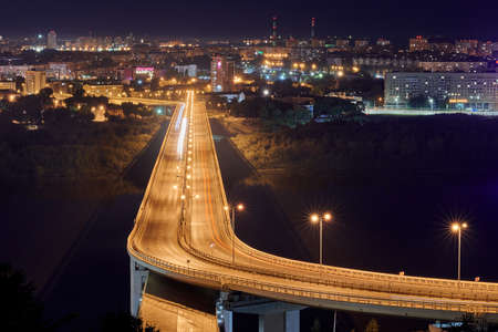 Nizhny Novgorod, Russia - 08.21.2020 - Nizhny Novgorod rapid transit bridge night lights. Metro bridge, metromost. Beautiful cityscape in night lightのeditorial素材