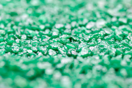 Emerald green gemstone pattern. Glitter semiprecious stones for decoration, flat lay, top view background. Shallow DOFの写真素材