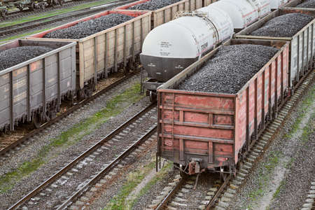 Kaliningrad, Russia - 12.07.2020 - Train classification yard with wagons loaded with coal and fuel. Marshalling wagons for freight train. Separating railway cars.のeditorial素材