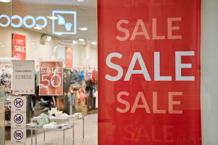 Russia, Kaliningrad - 02.15.2021 - New Year's sale time at Europe shopping center. Christmas promotions in clothing store. Seasonal sale 50%, holiday discounts in shopping mall.のeditorial素材