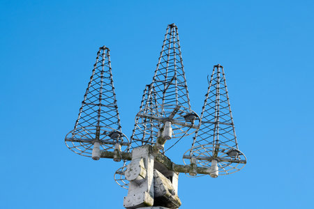 Navigation and radar equipment and antenna on mast of ship. Mast of large yacht with navigation equipment, bottom view. Radar, signal lights and satellite dishes.の写真素材