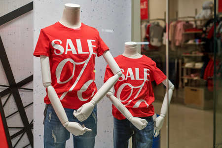 Seasonal super sale, holiday discount in shopping mall. New Year's sale time at european shopping center. Black Friday. Christmas promotions in clothing store.の写真素材