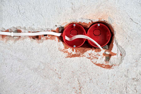 New electrical wiring installation, plastic socket box and electrical wires for future outlet...