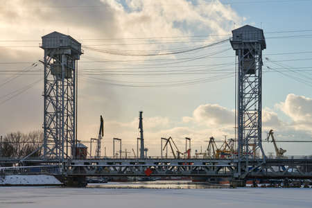 Two-tier vertical lift bridge with railways car road. Industrial cityscape. Bunk bridge in...