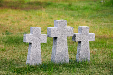 Three catholic stone crosses in German military cemetery in Europe. Memorial for dead soldiers of World War II in Baltiysk, Kaliningrad oblast, Russiaの写真素材