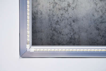 Strip LED light with square aluminum profile. Stretch ceiling with LED lighting in residential...