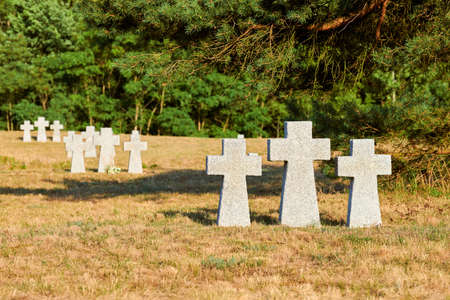 Catholic granite stone crosses in German military cemetery in Europe. Memorial for dead soldiers of...