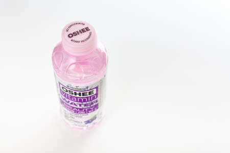 Kaliningrad, Russia - 09.11.2021 - Oshee vitamin water bottle isolated on white background, vitamin enriched sports drink for active peopleのeditorial素材