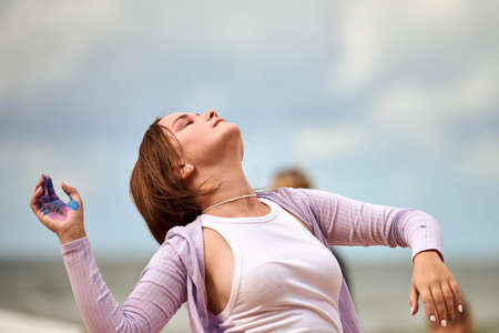 Svetlogorsk, Russia, 08.15.2021 - Female dance performance at seaside, sounds of sea waves, horizon...