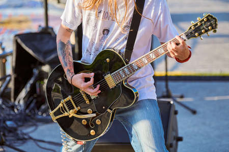 Svetlogorsk, Russia - 08.15.2021 - Rock musician playing guitar at outdoor heavy metal festival....