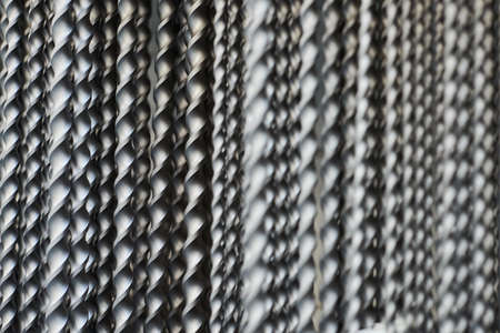 Hammer drill bits in hardware store background, small depth of field. Bunch of drill bits for...