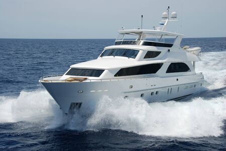 Luxury yacht running left