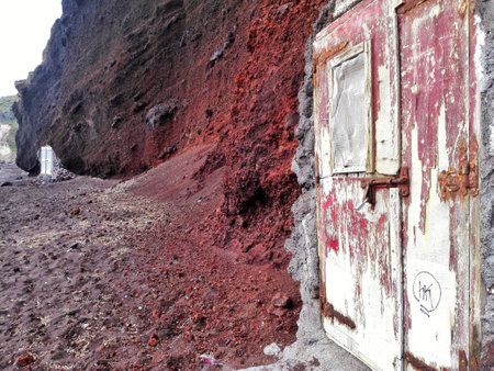 Abandoned Door in Red Coastal Cliffsの写真素材
