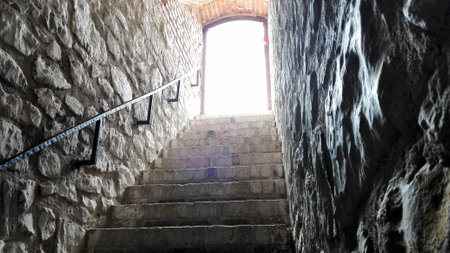 The stairway in some medieval castle showing the way up to a better and brighter life.の写真素材