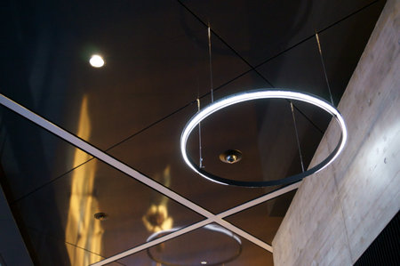 Lamp on the ceiling of a modern office building, closeup of photo