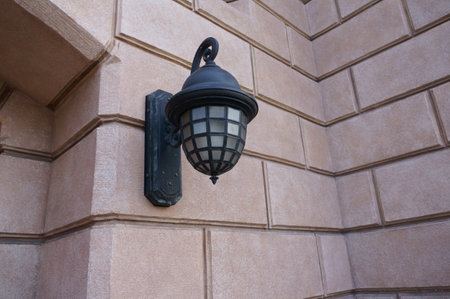 lamp on the wall of the building, closeup of photoの写真素材