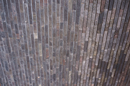 The uneven tiled outer wall of the store