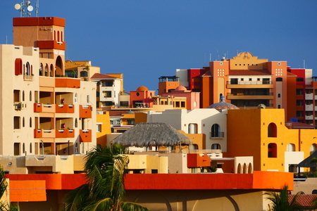 Orange Colored Buildings Against Blue Skyのeditorial素材