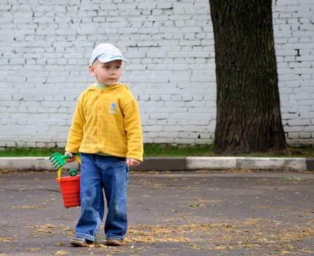 Little boy going to go play in the sandboxの写真素材