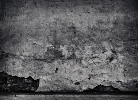 Black Cracked concrete texture closeup backgroundの写真素材