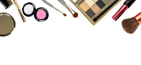 Cosmetics set with brushes and eyeshadows isolated on white for border or backgroundの写真素材