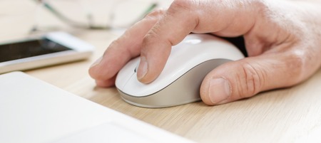 Hand on computer mouse.の写真素材