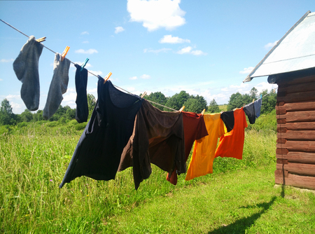 Washing line with drying clothes in outdoor.の写真素材