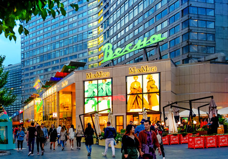 Moscow - July 20, 2019: People Walk in evening twilight on New Arbat Avenue - popular tourist street in Moscow with shops and cafe . Famous landmarks in Moscow.のeditorial素材