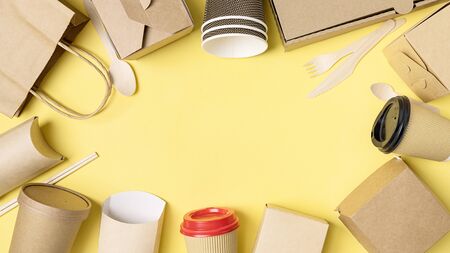 Various Fast food packaging set on yellow background. Food delivery service. Top view. Copy space.の写真素材