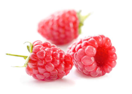 Ripe red raspberries on white