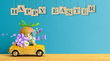 Retro car carrying an easter egg and bunch of flowers on the roof. Copy spaceの写真素材