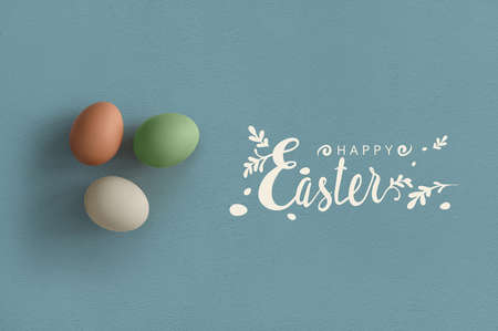 Colorful eggs top view with happy Easter lettering
