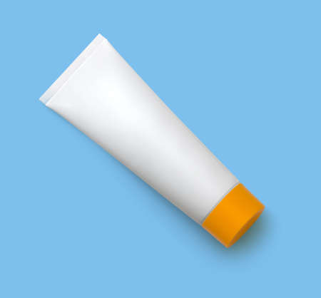 White cosmetic tube with orange cap with sunscreen cream isolated on blue background.
