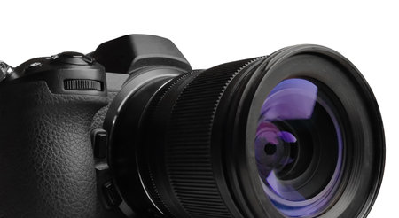 Mirrorless photo camera with zoom lens on white background