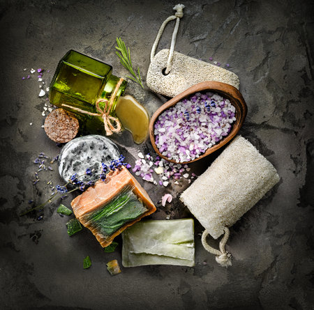 Handmade organic Soap and spa body care products on a black textured backgroundの写真素材