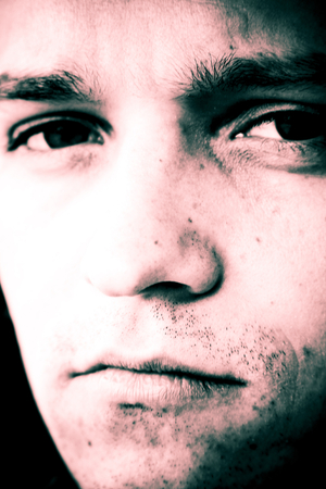 Portrait of man with sad expression.