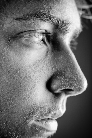 Black and white portrait of a man's sweaty face after a bath . Portrait orientation.
