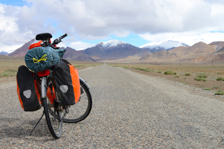 Long distance cycling on M41 Pamir Highway, Pamir Mountain Range, Tajikistanの写真素材