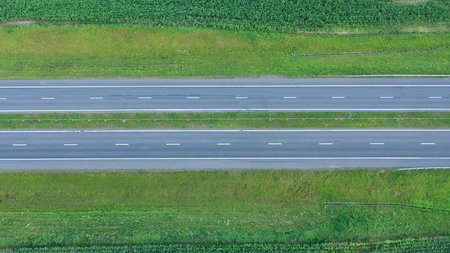 Empty Speed Intercity Highway Through Agricultural Cornfield With Aerial View