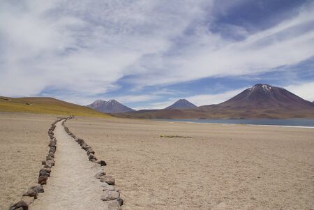 Path in the altiplano landscapes of volcano in the atakama desert of chileの写真素材