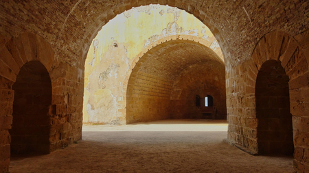 Stone walls and vaults from an old fortress in Italy
