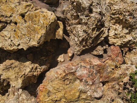 Wall with several boulders in different colours
