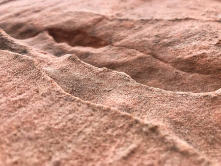 A close-up of small sand dunes with strong blurring