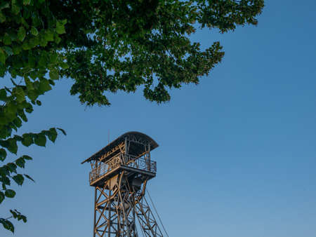 A beautiful steel winding tower from an old mine shortly before sunsetの写真素材