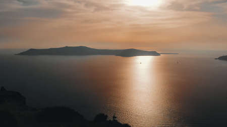 Iconic sunset in the town of Oia on the greek island Santoriniの写真素材