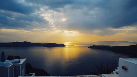 Iconic sunset in the town of Oia on the greek island Santorini